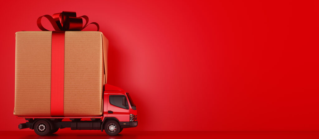 Red truck delivering holiday gifts to their destination